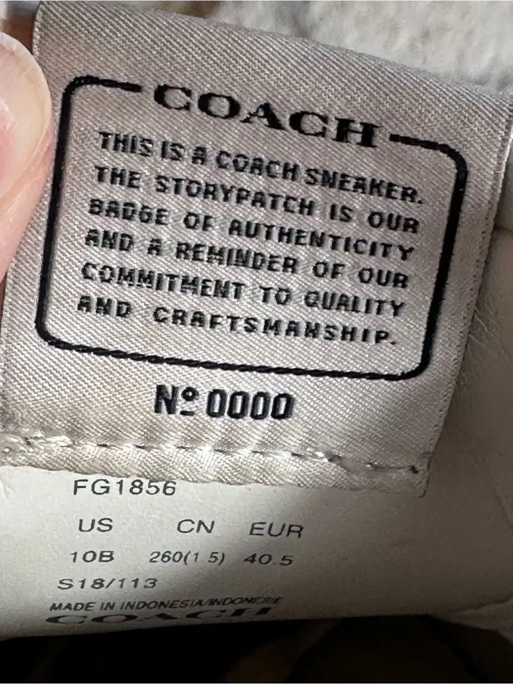 Coach Women's cream leather Signature Embossed Sneakers